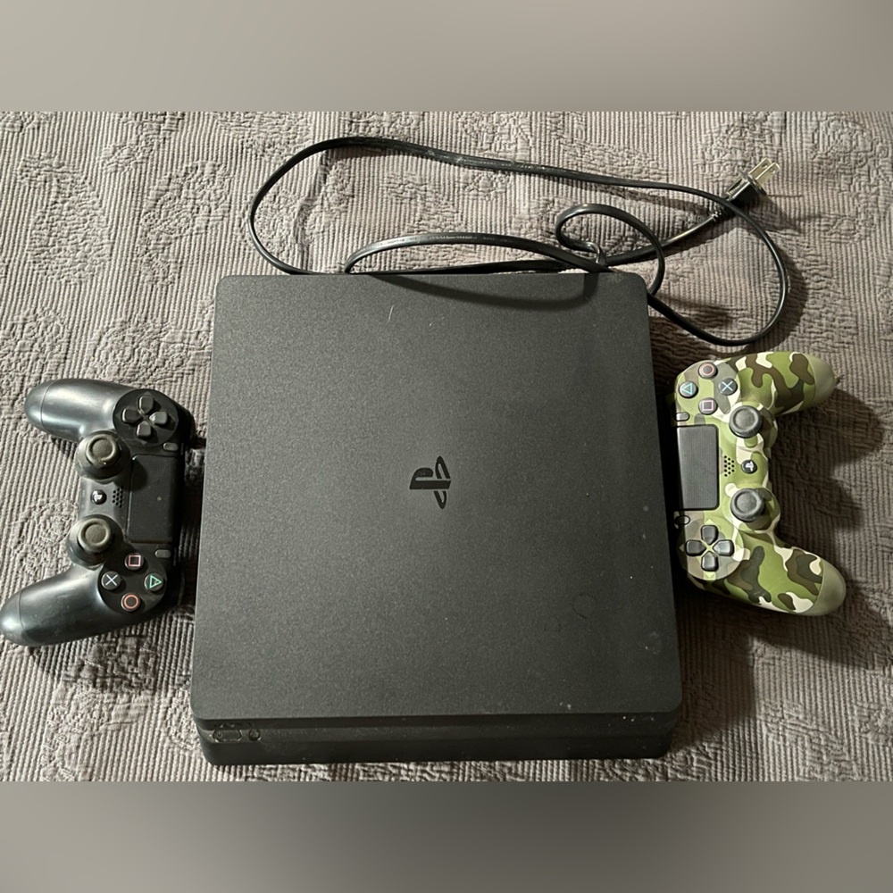 PS4 Sony Console with a Black and Camouflage Controller